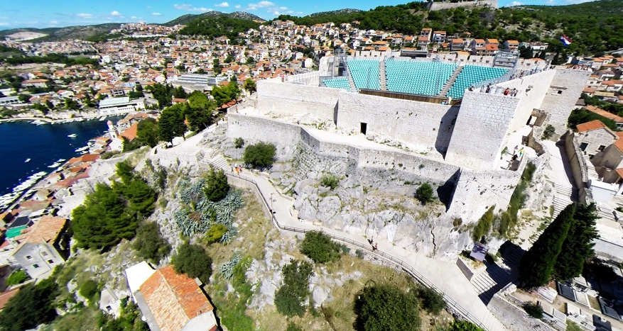 a castle next to the ocean with its moat in the middle