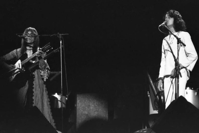 the band with glasses on performing at a concert