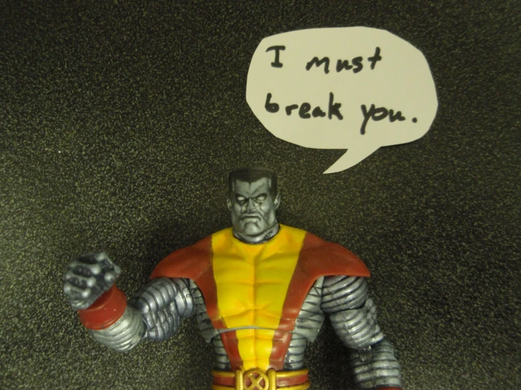 a fake action figure has a speech bubble on his head