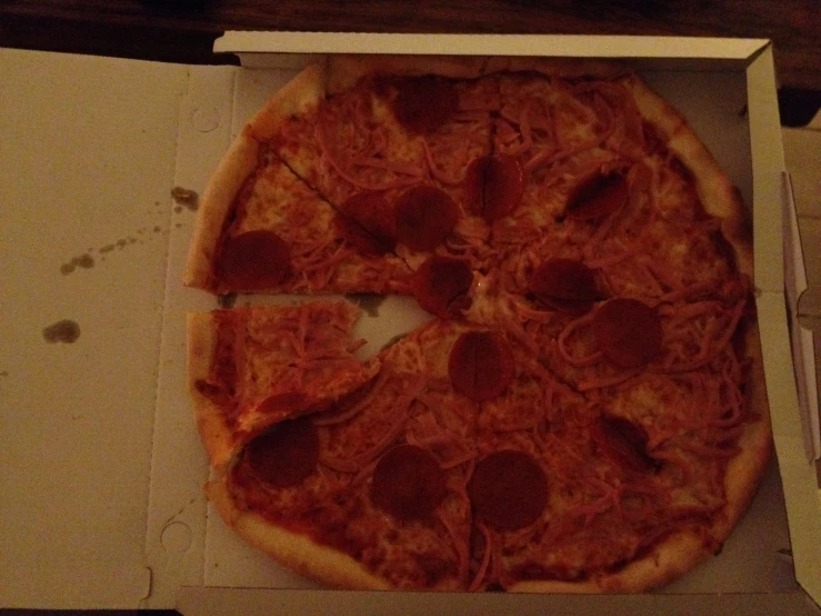a pizza cut into 4 pieces with one missing
