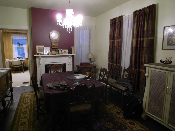 an old fashioned dining room table, and some old furniture