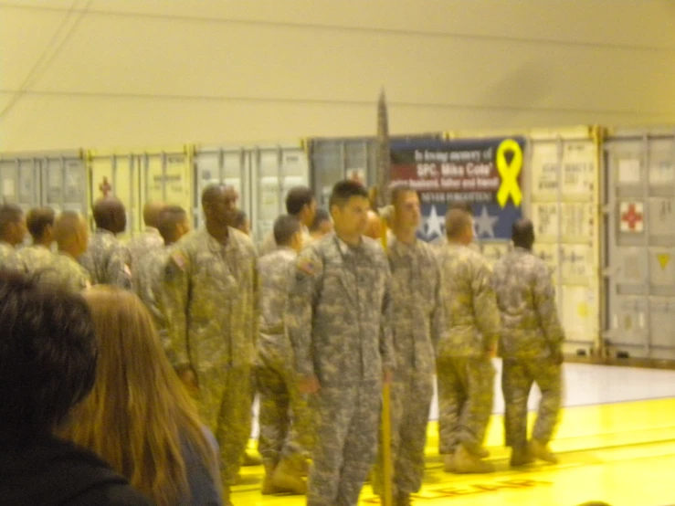 soldiers walking in line for a presentation to the audience