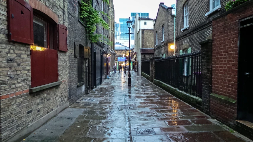 a quiet city street is lined with buildings