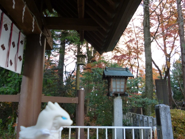 a ceramic animal is under a covered gazebo