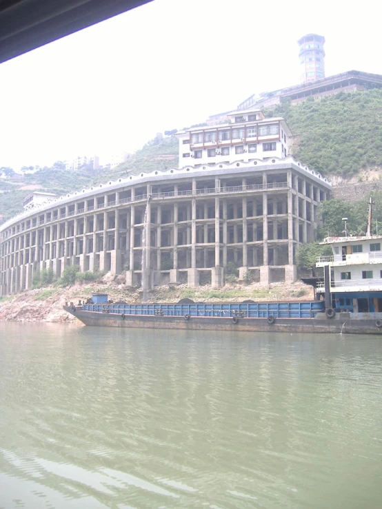 a boat passes the el on the river