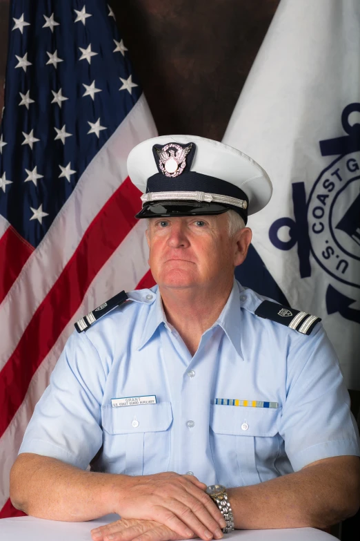 a man wearing a uniform and a necklace