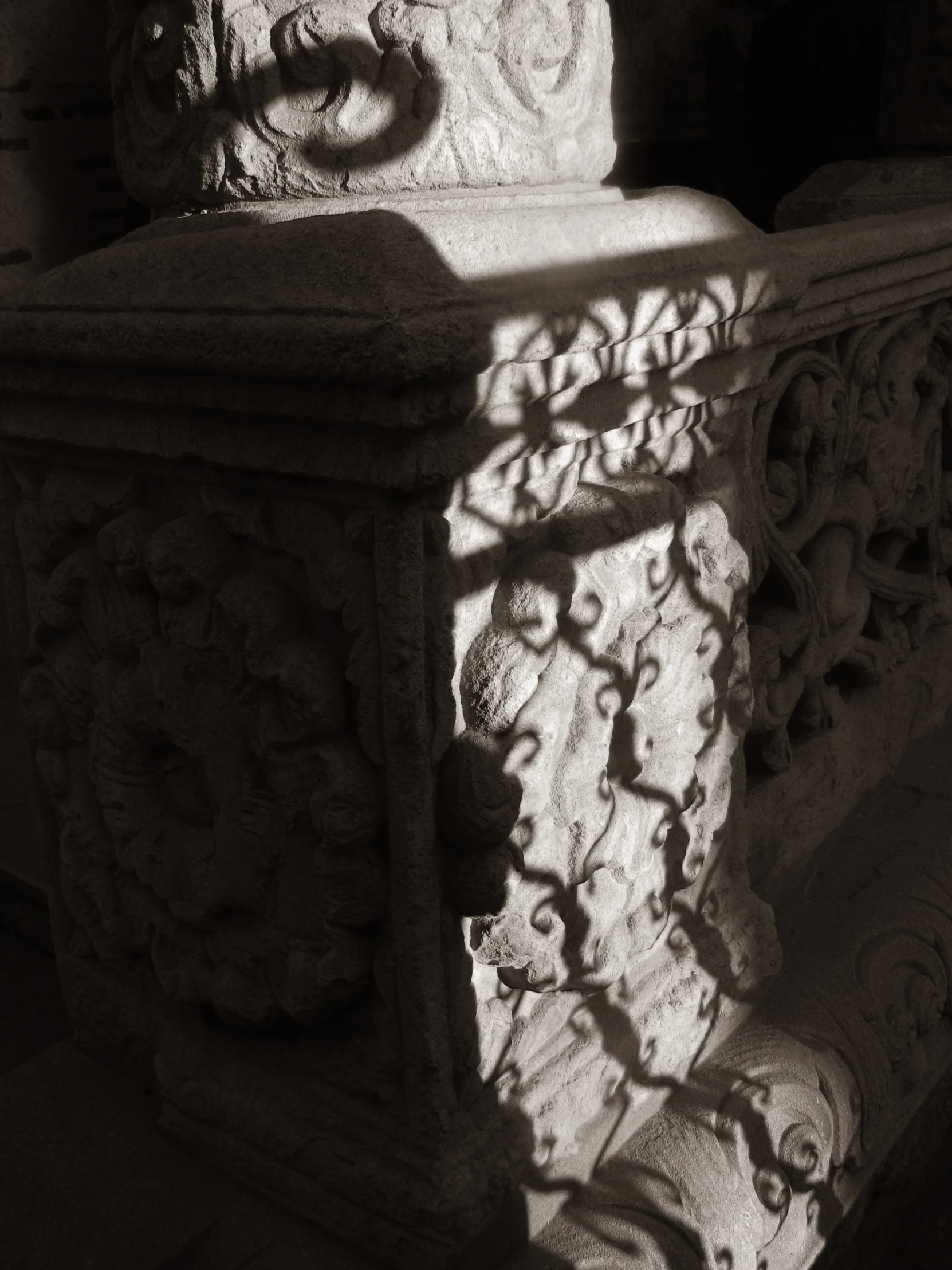 a black and white po of an outdoor stone statue