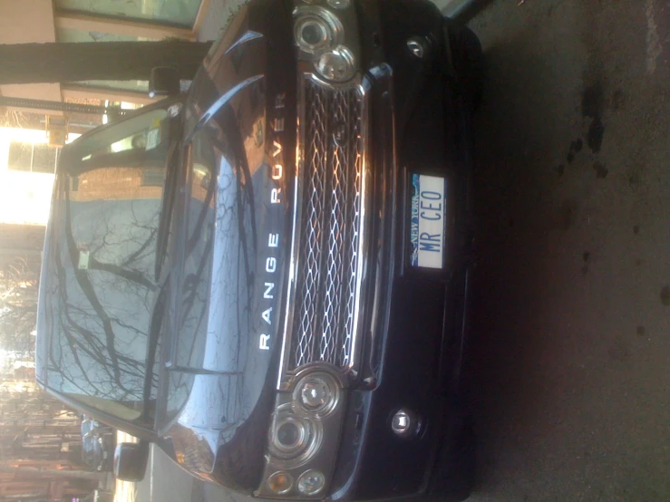 the front view of a range rover suv parked on a street