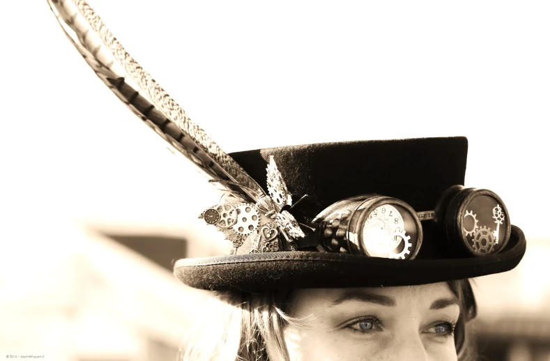 a woman with a hat on and feathers attached to her head