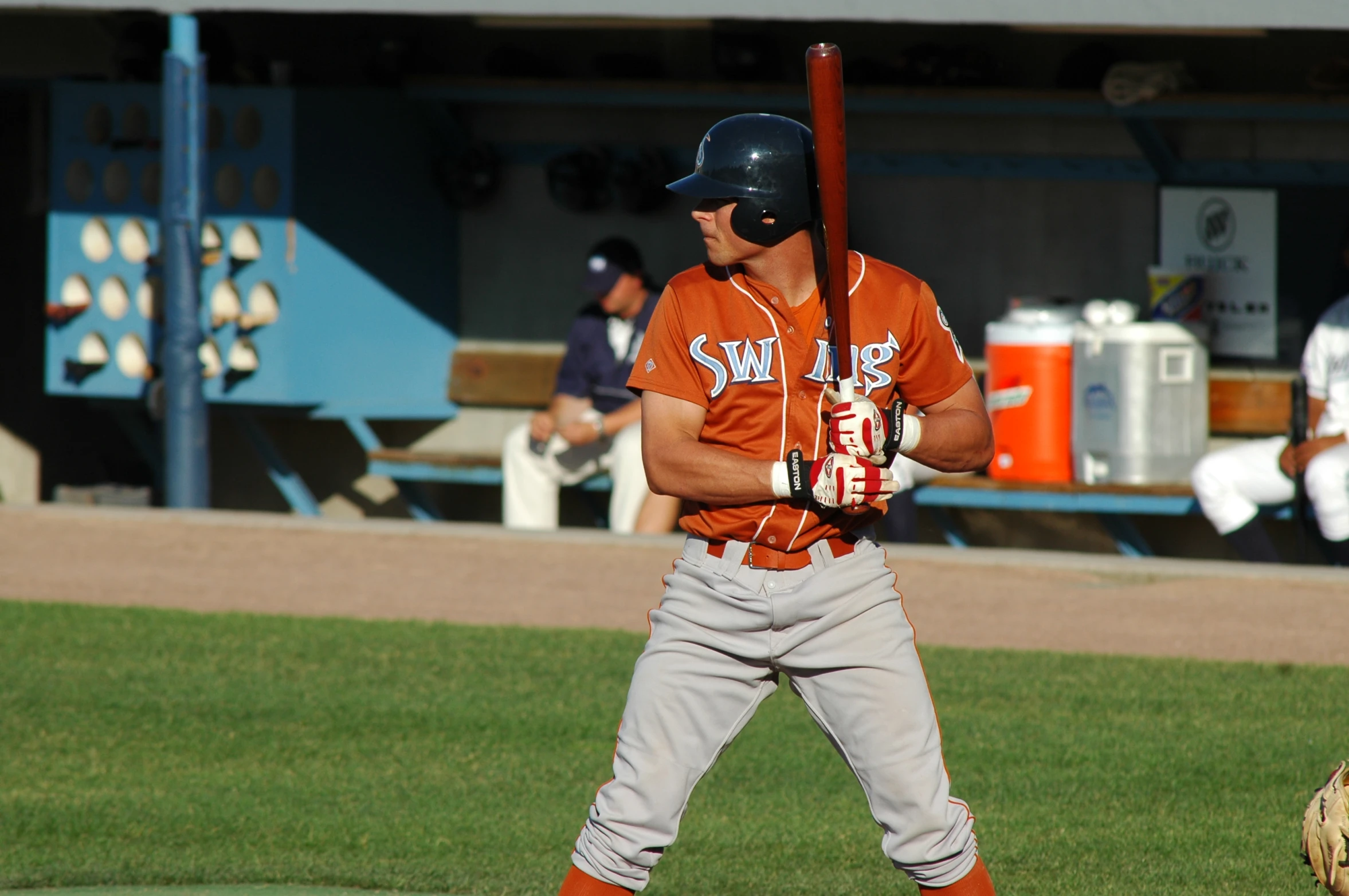 a professional baseball player is holding the bat