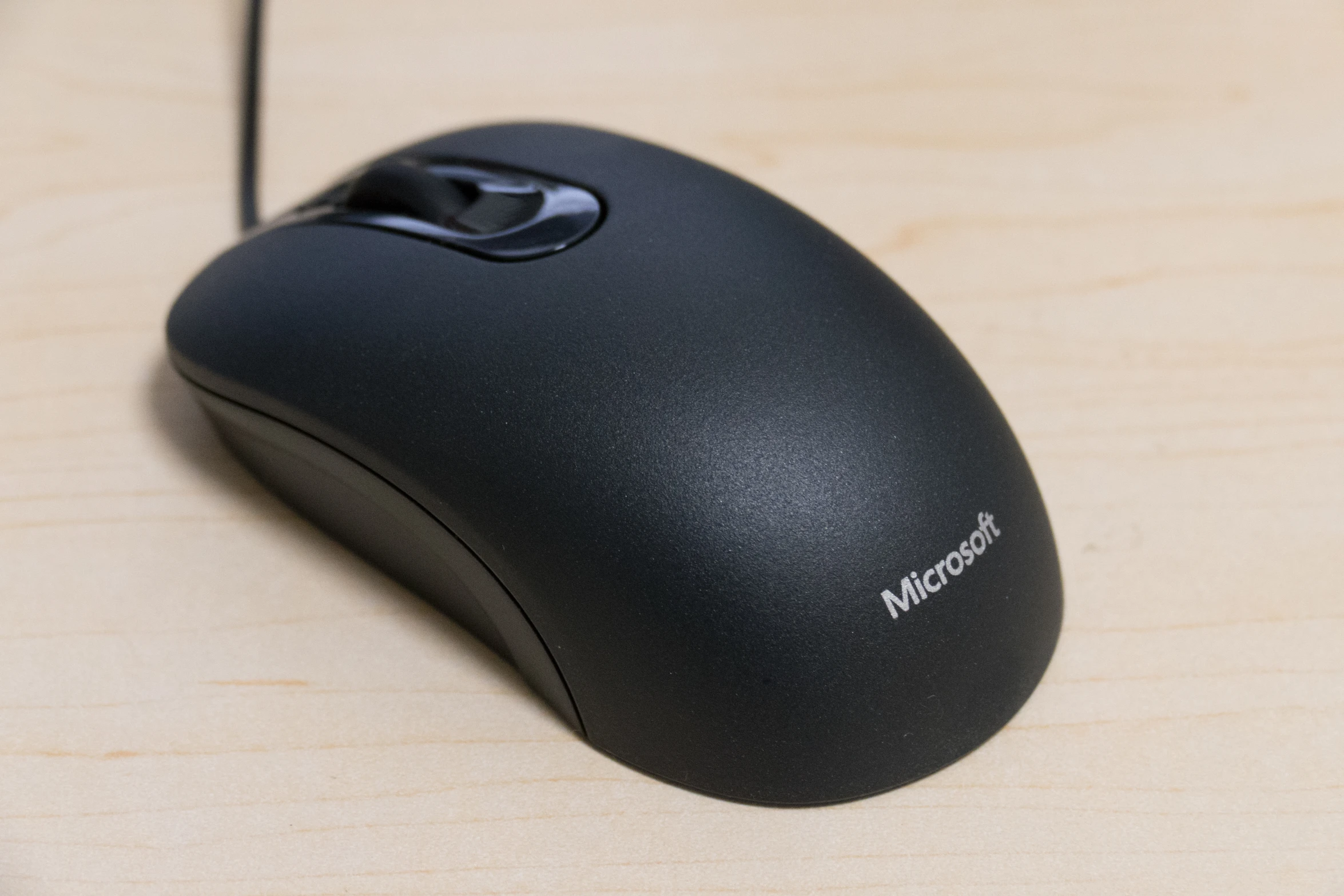 a close up view of a black microsoft mouse