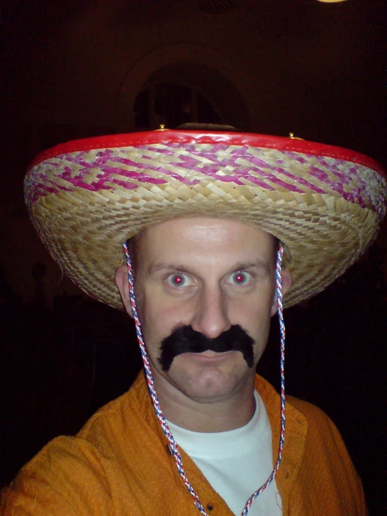 a man with a fake mexican hat on