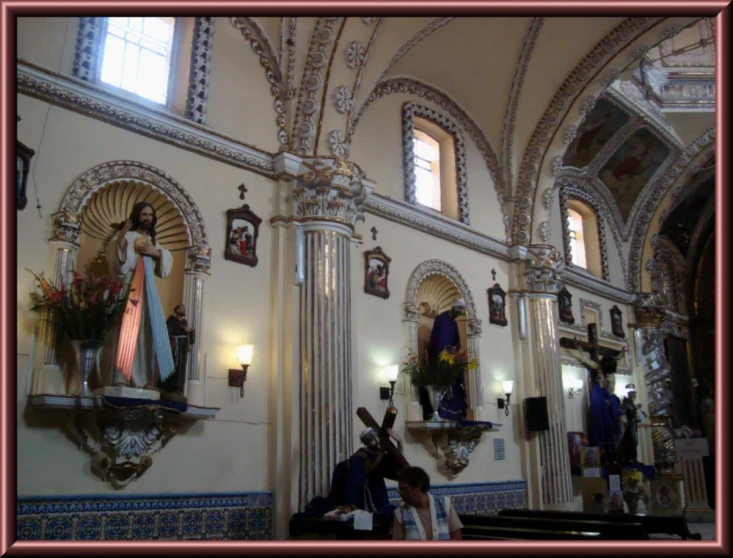 a woman sitting at a alter inside of a church