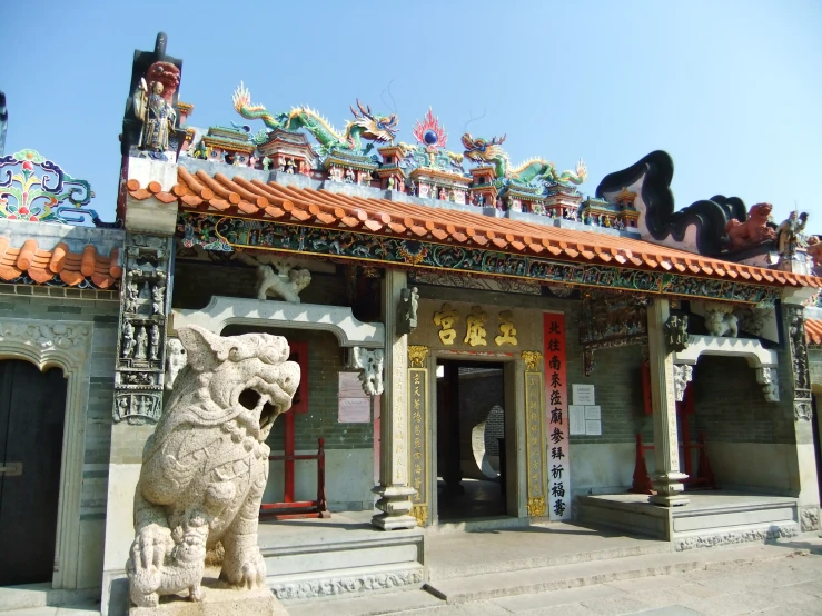 stone carving of an asian dog at a chinese temple