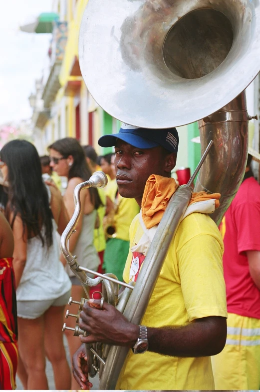 a man is playing a ss trombone in the street