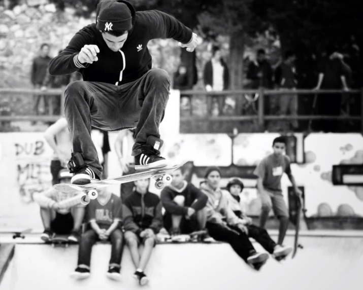 a man riding a skateboard on top of a wooden ramp