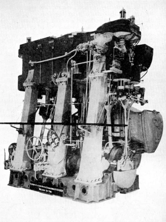 a large industrial type machine with an electrical box on the back