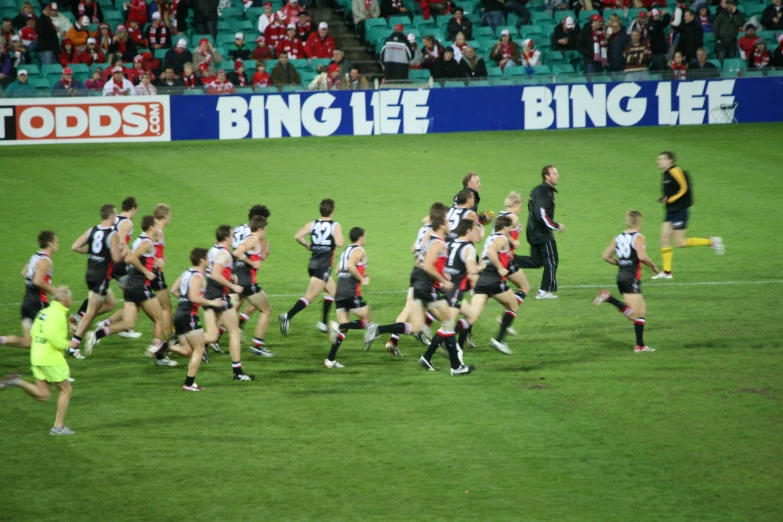 some men running around a field during a game