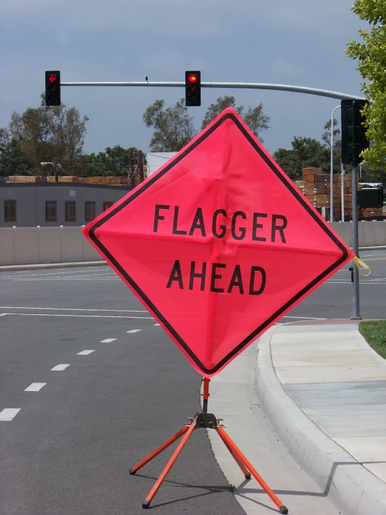 a sign with an orange caution standing on one leg