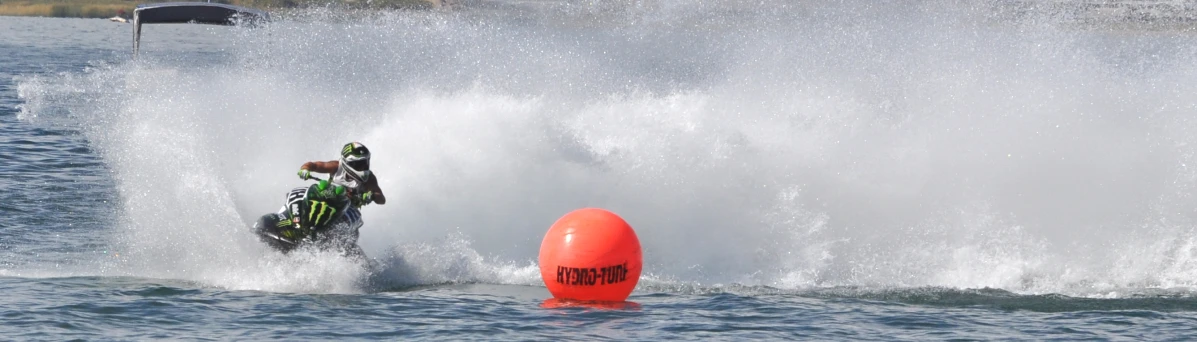 a man on a jet ski getting pulled in the water