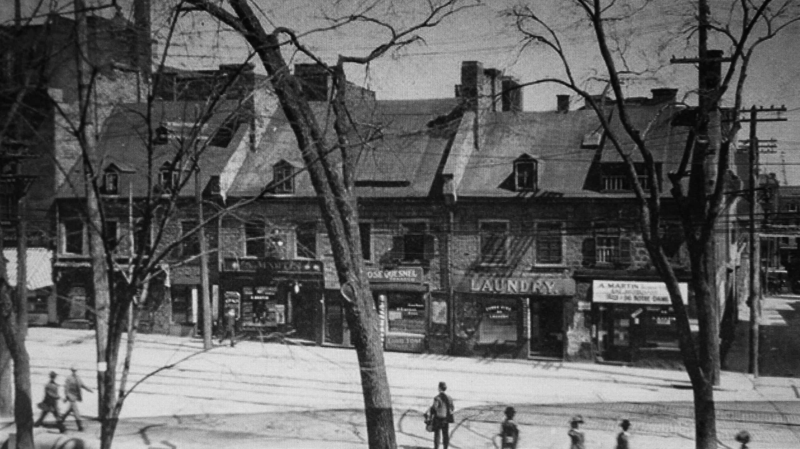 a black and white picture with people walking around on a snowy day