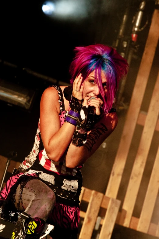 a person with some weird hair on stage