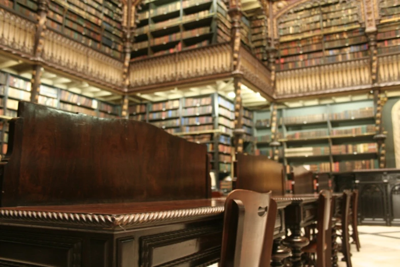 an old liry is full of books, a desk and chairs