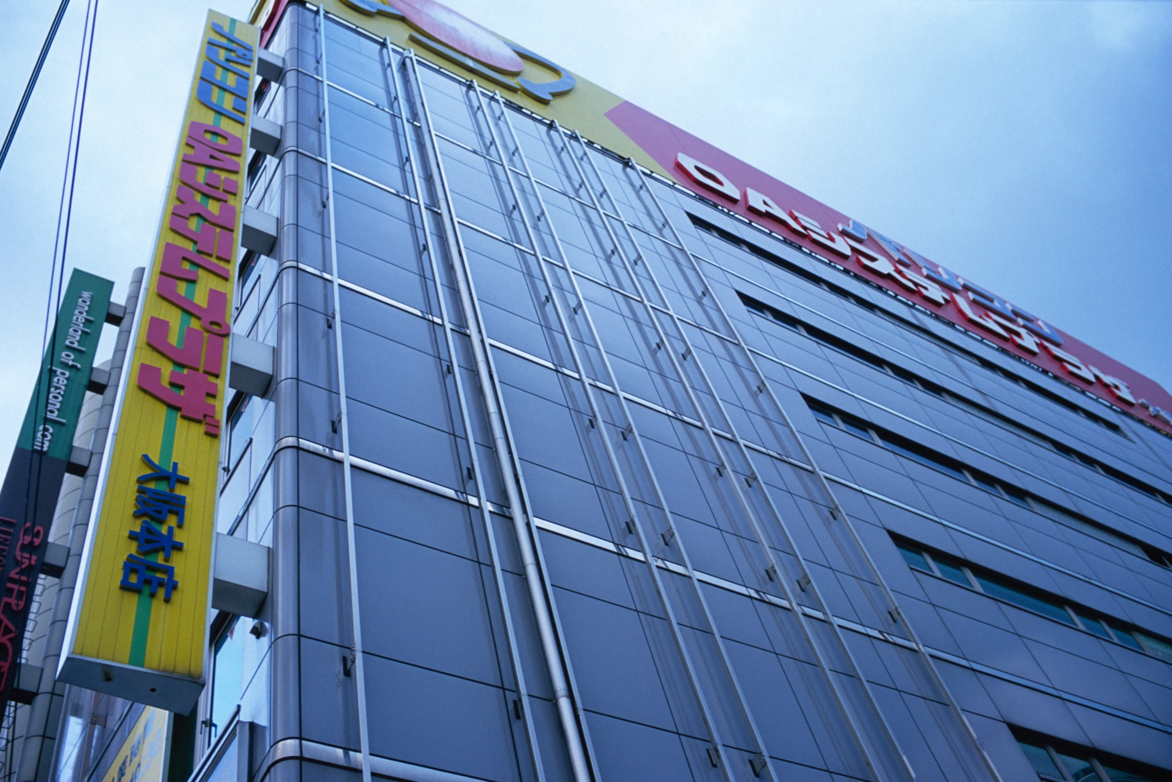 the corner view of a business building with large windows