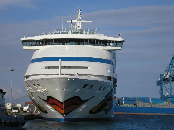 large white and blue cruise ship sitting in the water