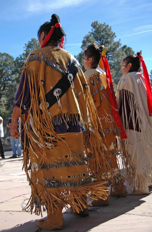 a group of people standing in front of each other