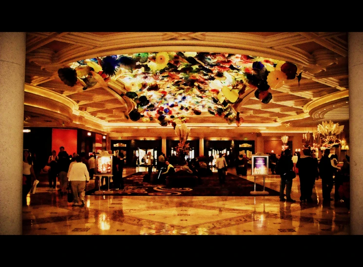 an ornate ceiling with many chandelier and decorative lights