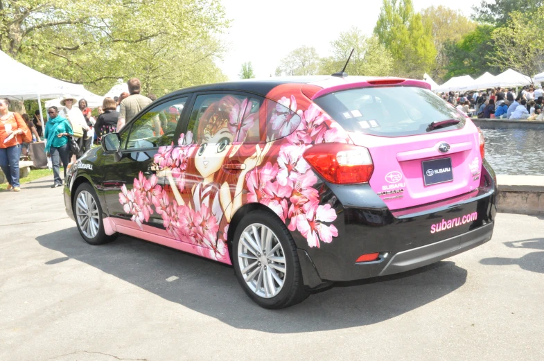 pink and black car decorated with floral design