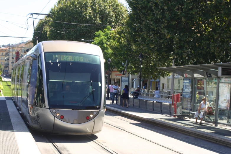 there is a tram that has pulled into the station