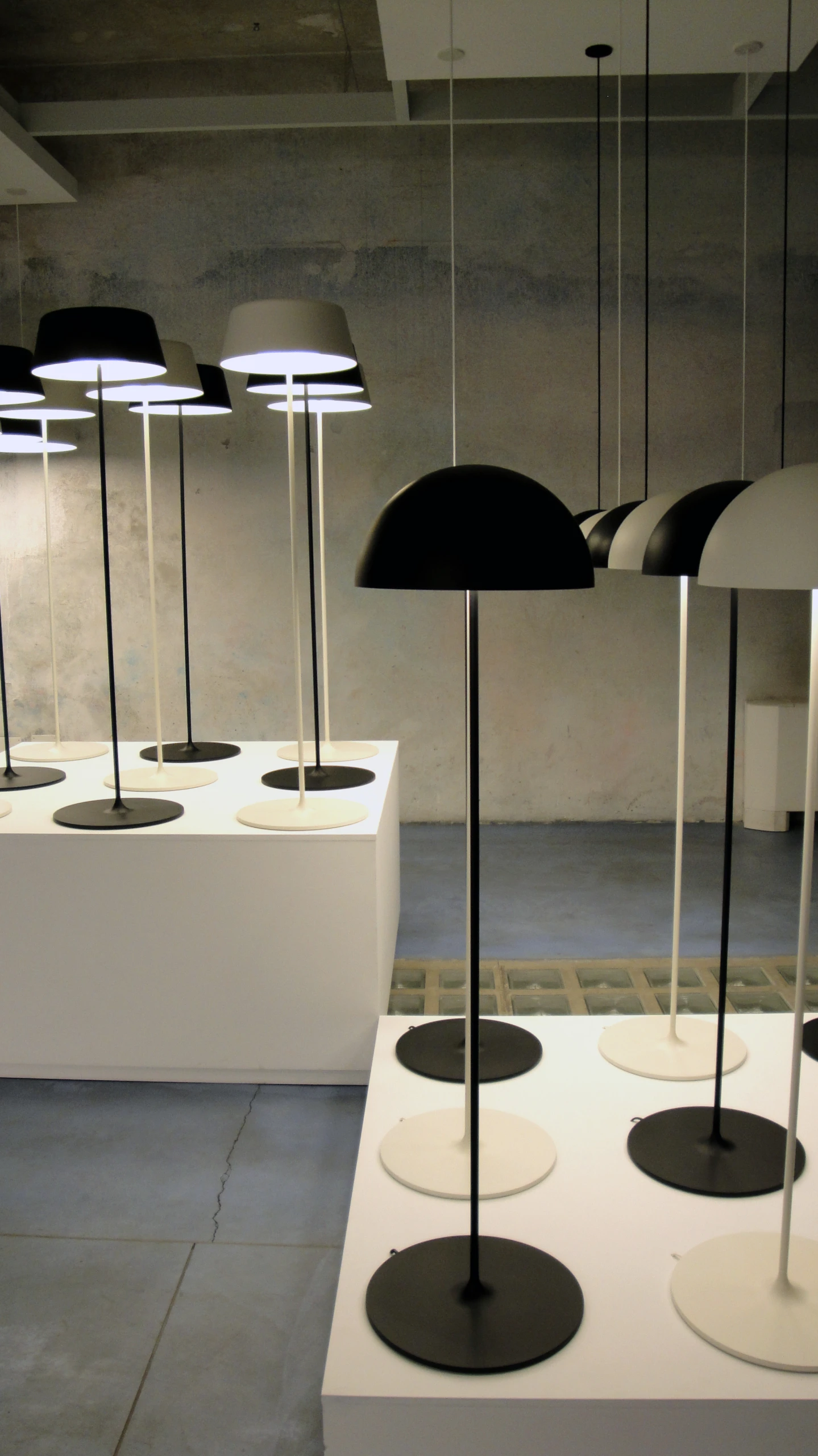 a number of light fixtures on display in an museum