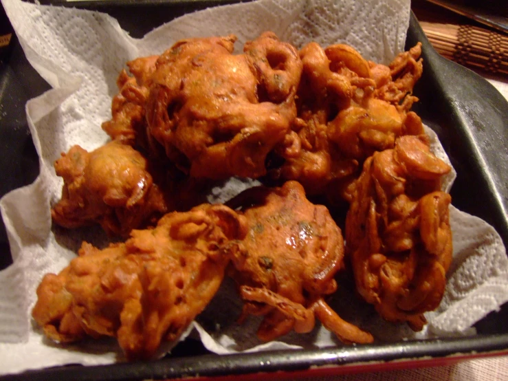 some food on top of some tissue paper on a table