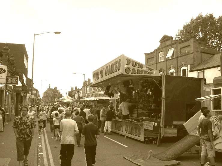 a large crowd of people walking down the street