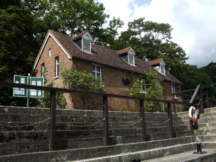 the building has many windows and some bushes