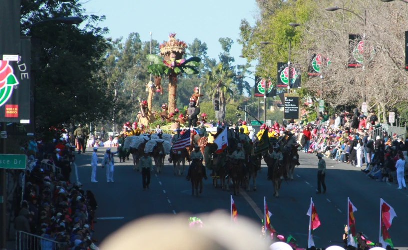 a large crowd of people walking down the road