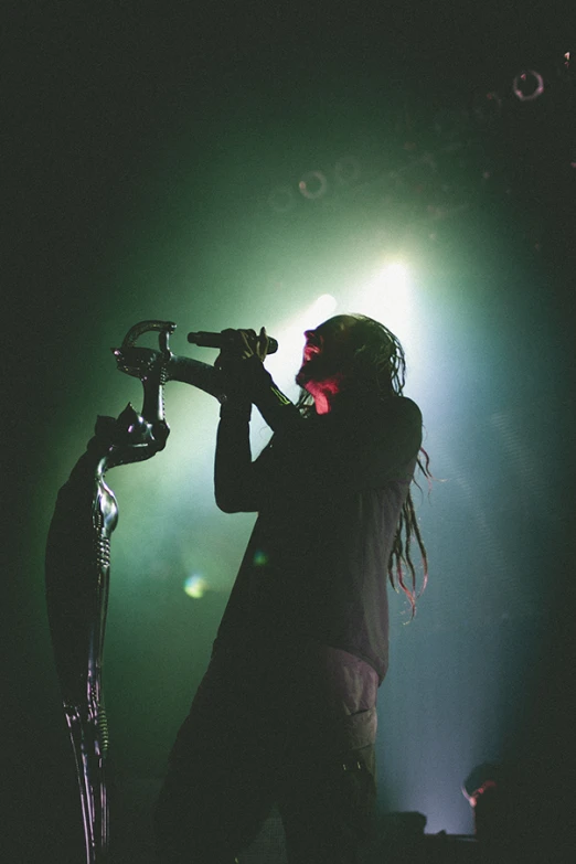 the man with dreads plays his musical instrument