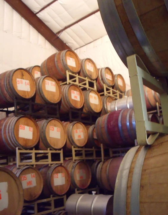 the wine is stacked in wooden barrels