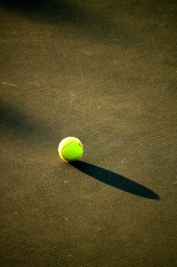 a tennis ball is sitting on the court