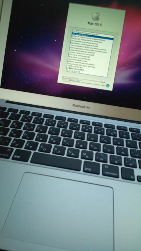 an open laptop computer sitting on top of a desk