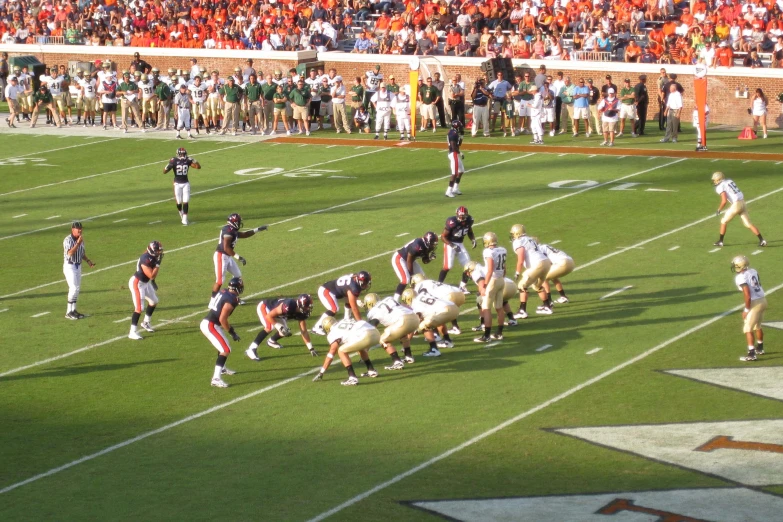a football team of american football standing on a field