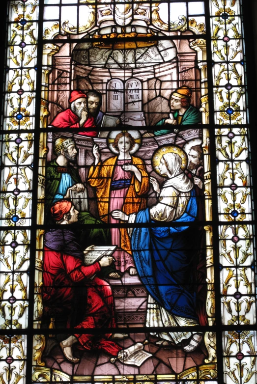 an image of jesus and mary on a stained glass window