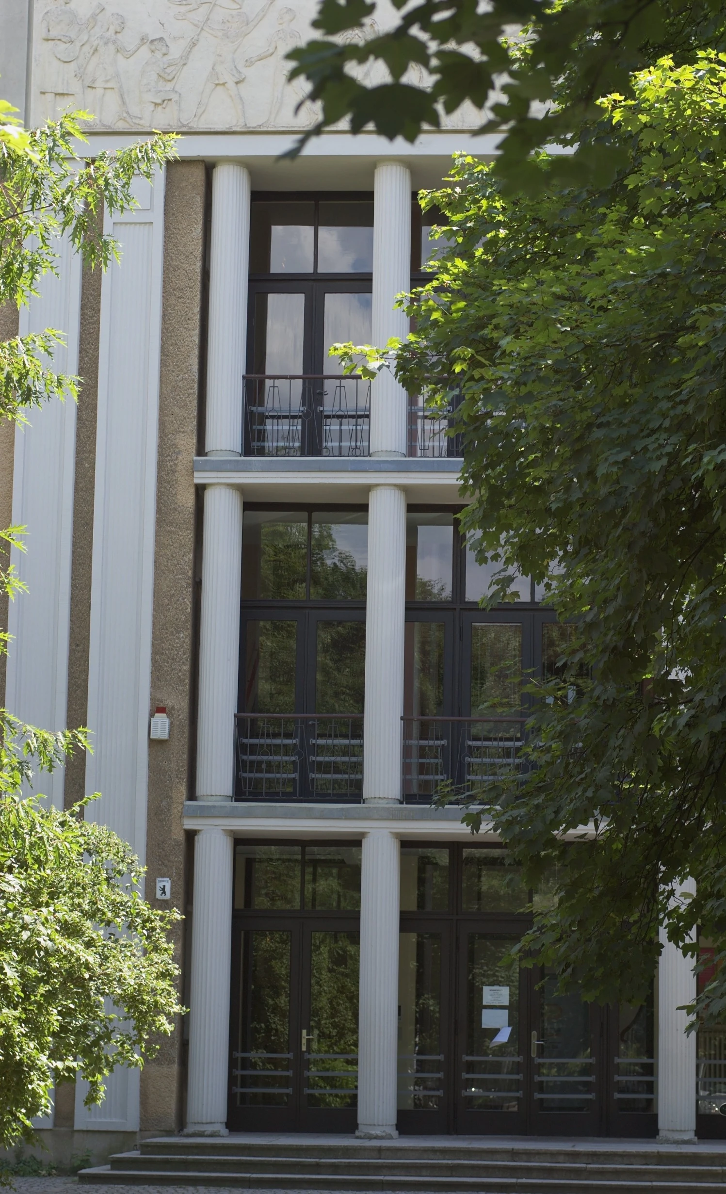 the outside of a building with a clock on top