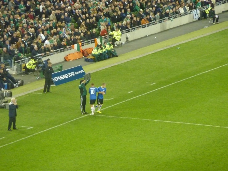 a soccer game being played in a stadium