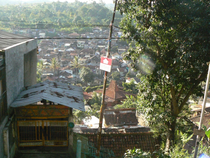 a small village on the hillside surrounded by a forest