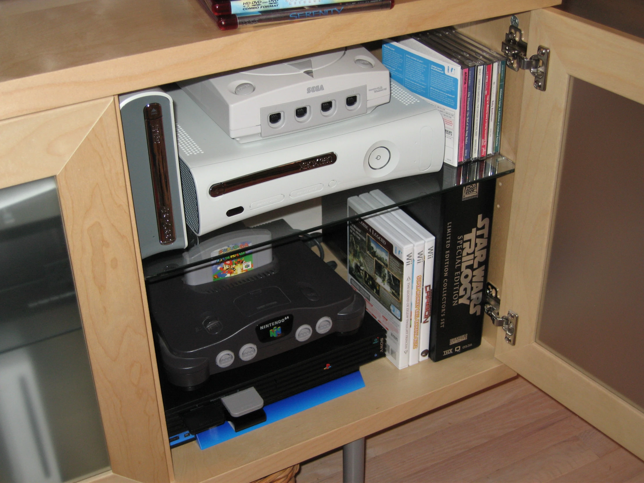 an assortment of games and video games in cabinet