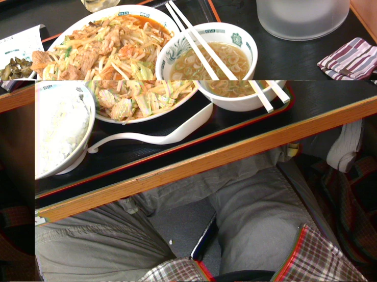 a table with bowls and plates filled with soup