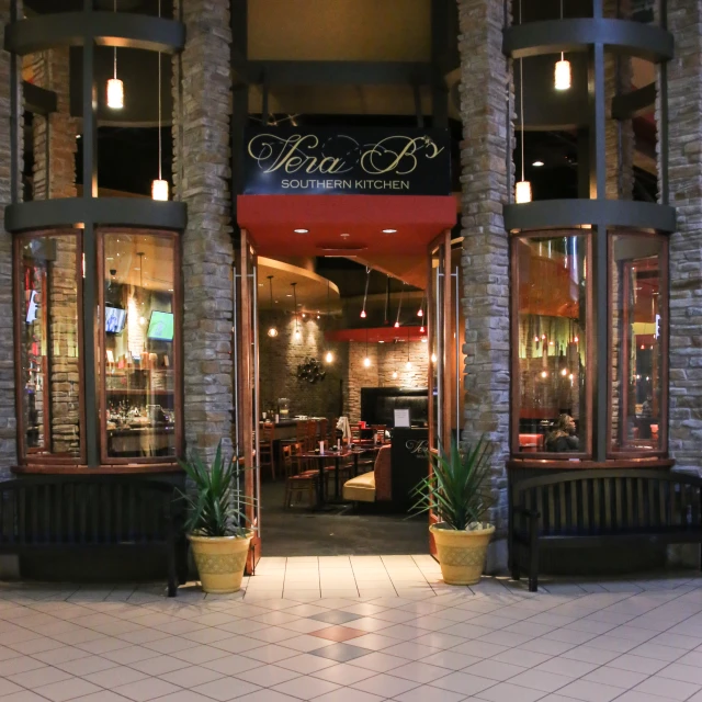 an entrance to the restaurant with seating